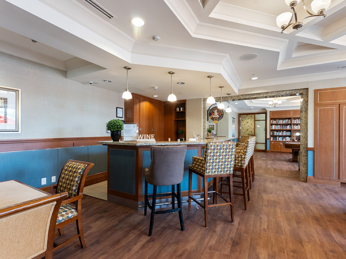 The bar area in the dining room of Walden Circle Retirement Home, with chairs set up for residents to enjoy.