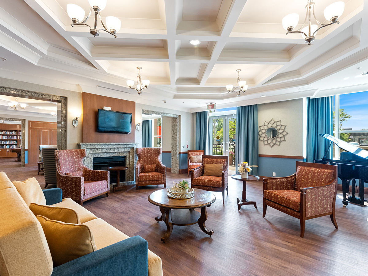 Bright and spacious living room at Walden Circle Retirement Home, offering a comfortable space for socializing and leisure activities.