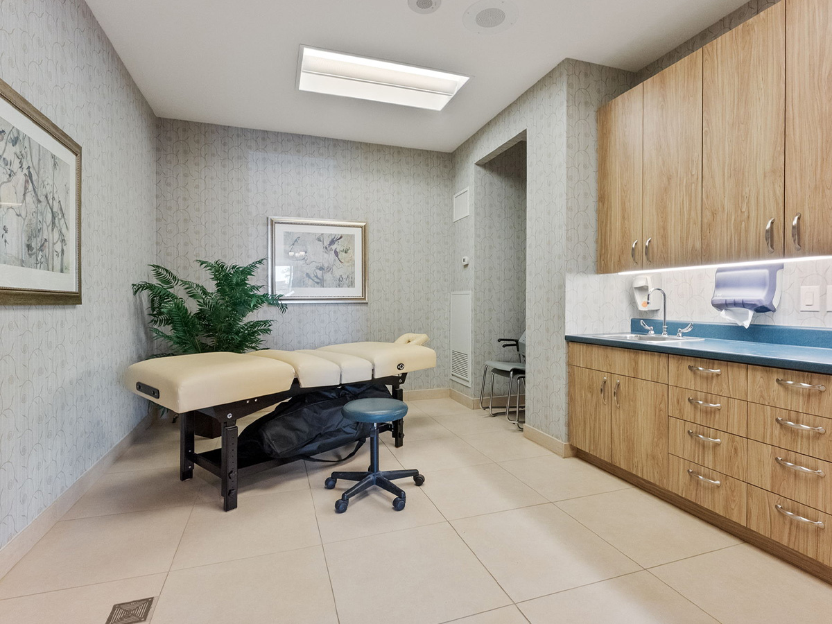 A spa room at Walden Circle Retirement Home featuring a desk and storage cabinets.